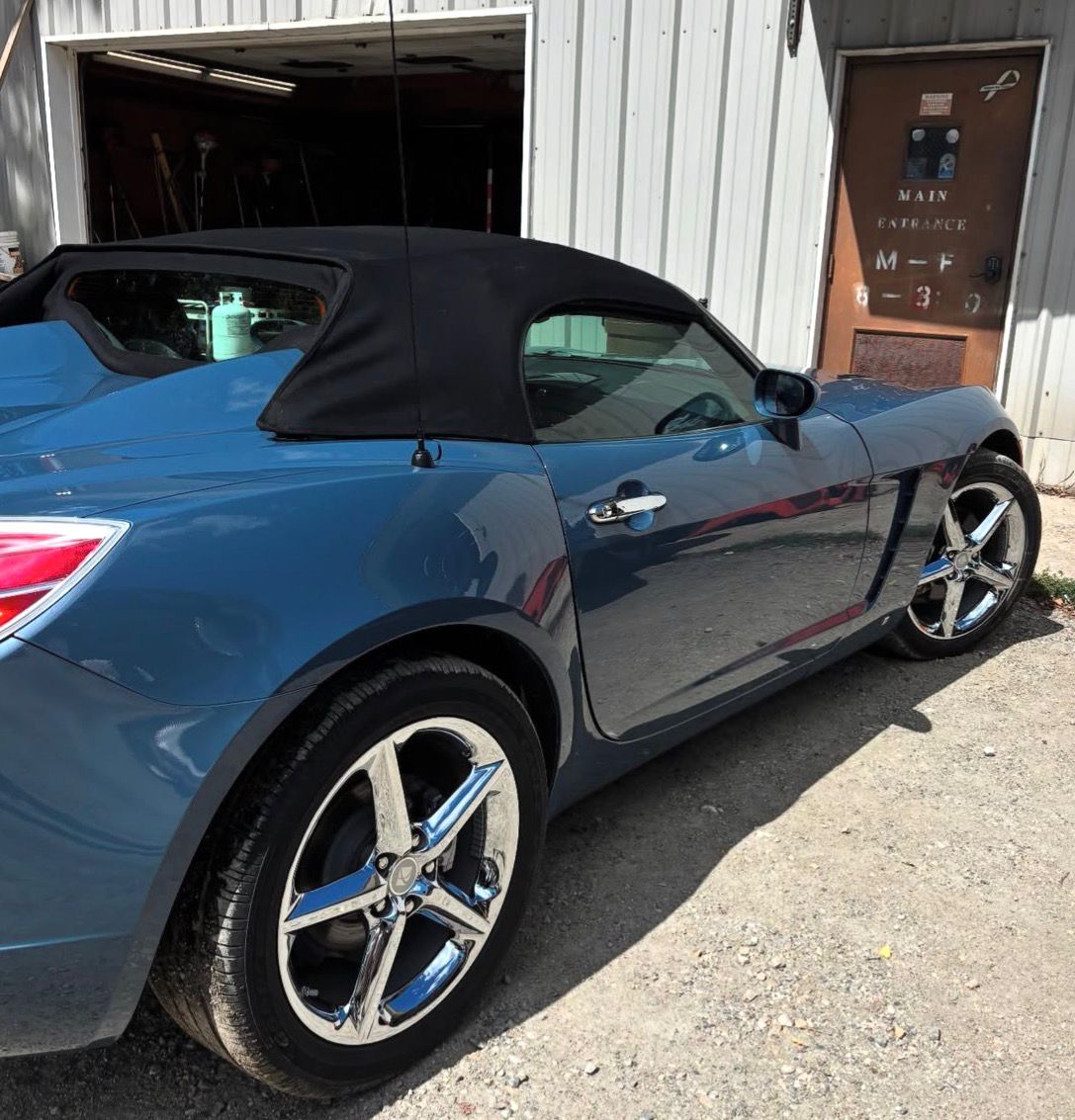 Pontiac Solstice convertible polished to a swirl-free gloss finish under studio lighting — detailed by S&F Detailing in Franklin County, Massachusetts