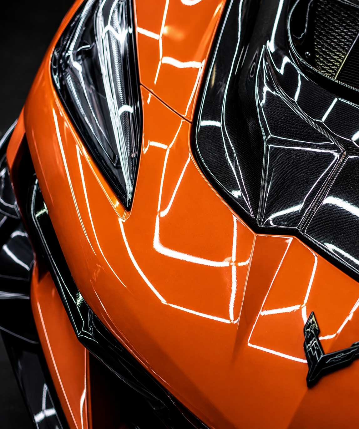 Orange Chevrolet Corvette with a deep gloss ceramic coated finish during a detail in Hampden County, Massachusetts
