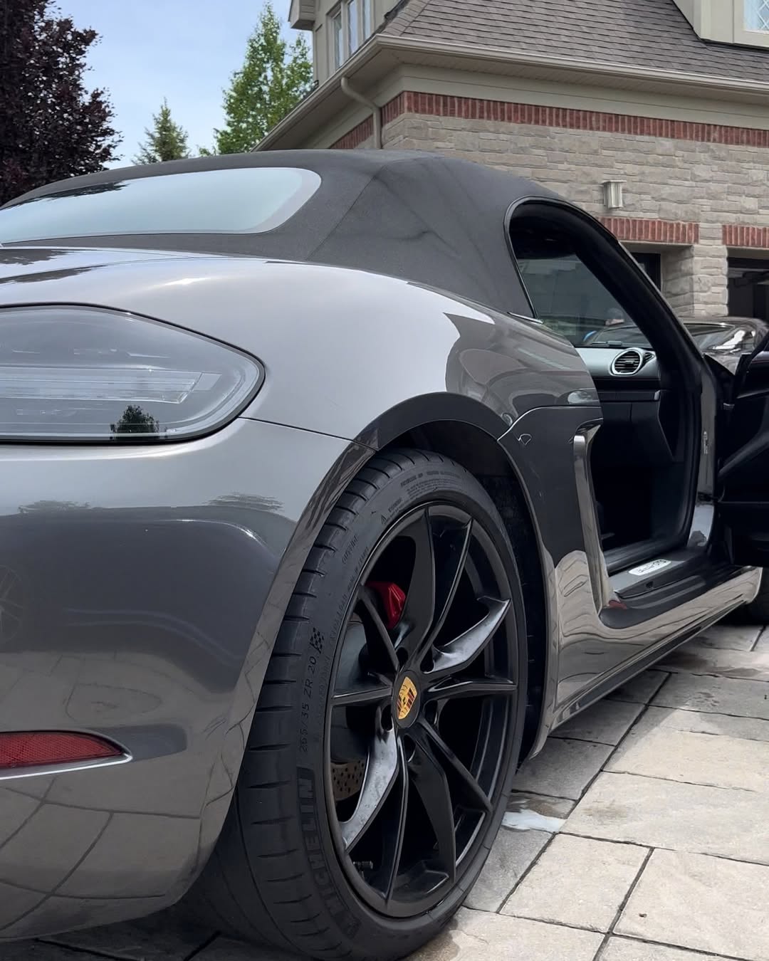 Grey Porsche 718 Boxster GTS with swirl-free polished paint after correction in Northampton, MA