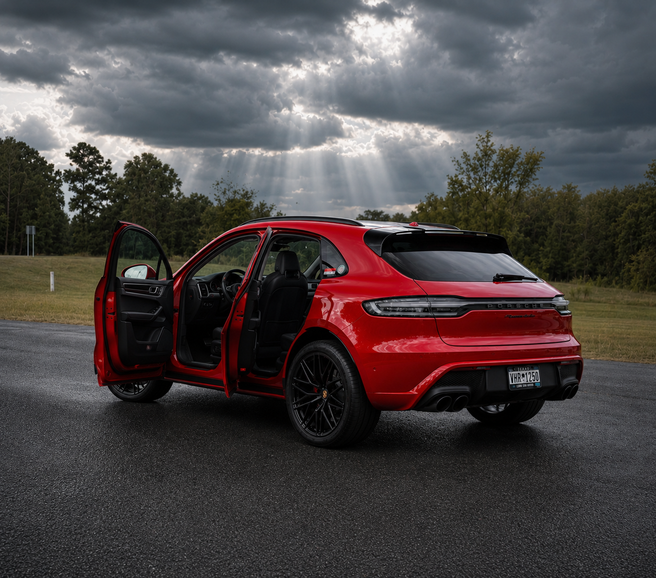 Red Porsche Macan with doors open after a full interior and exterior detail in Belchertown, MA