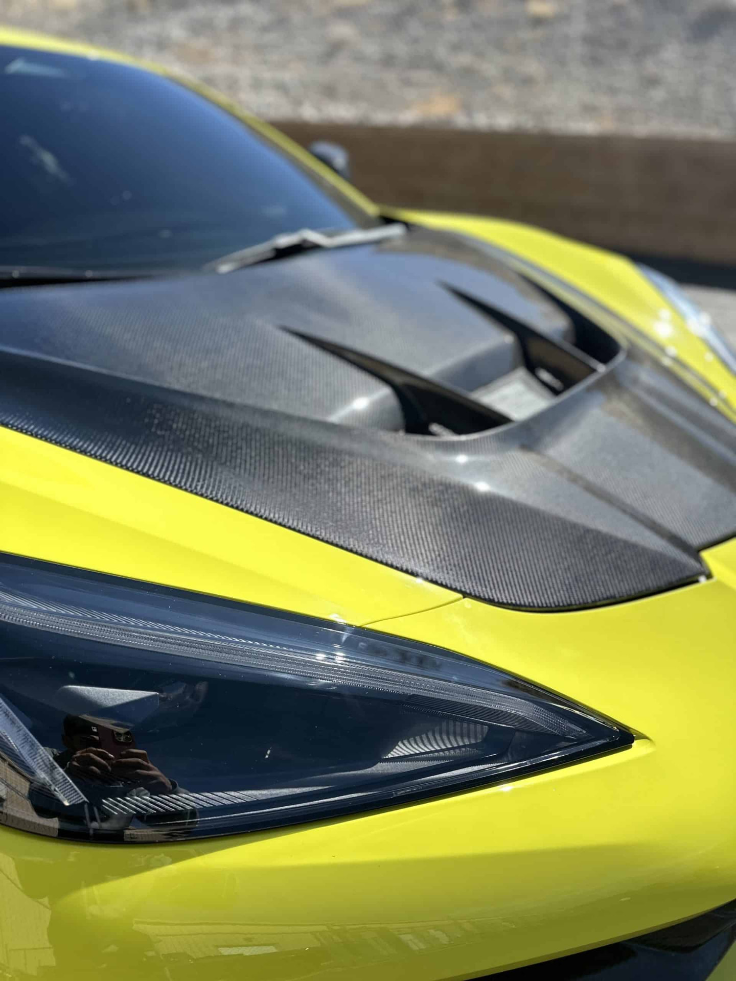 Yellow Chevrolet Corvette with carbon fiber accents after a ceramic coating detail in Hadley, Massachusetts
